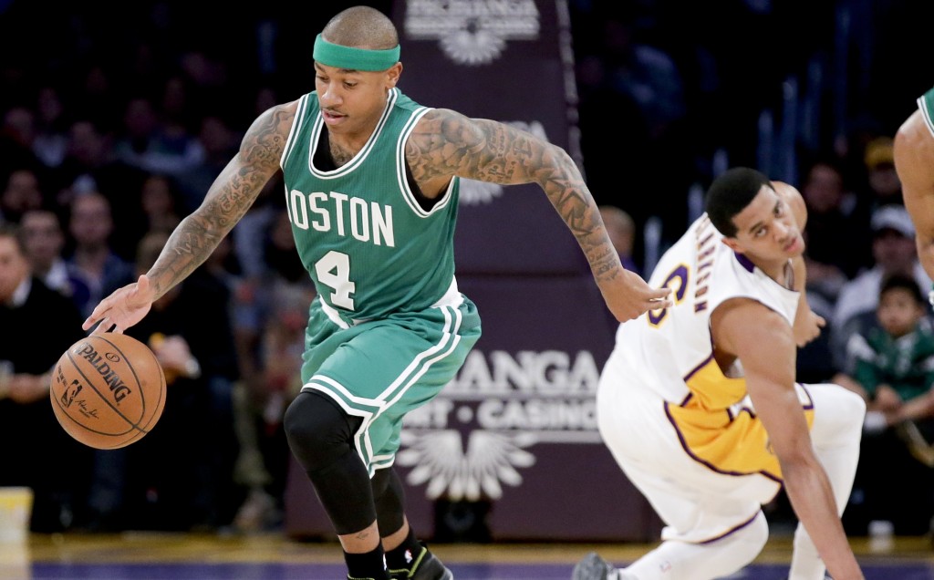 Boston Celtics guard Isaiah Thomas, left, steals the ball away from Los Angeles Lakers guard Jordan Clarkson during the first half of an NBA basketball game in Los Angeles, Sunday, Feb. 22, 2015. (AP Photo/Chris Carlson)