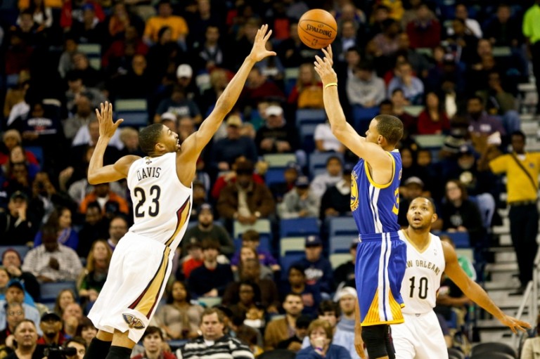 Nov 26, 2013; New Orleans, LA, USA; Golden State Warriors point guard Stephen Curry (30) shoots over New Orleans Pelicans power forward Anthony Davis (23) during the first quarter of a game at New Orleans Arena. Mandatory Credit: Derick E. Hingle-USA TODAY Sports